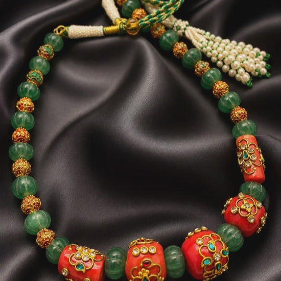 Handcrafted green carved beads and coral necklace with intricate jadau work and traditional ethnic detailing