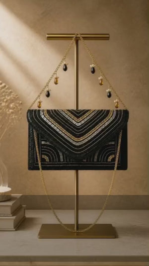 Luxury black beadwork bag with gold sequin embroidery and elegant chain sling design for evening and party wear