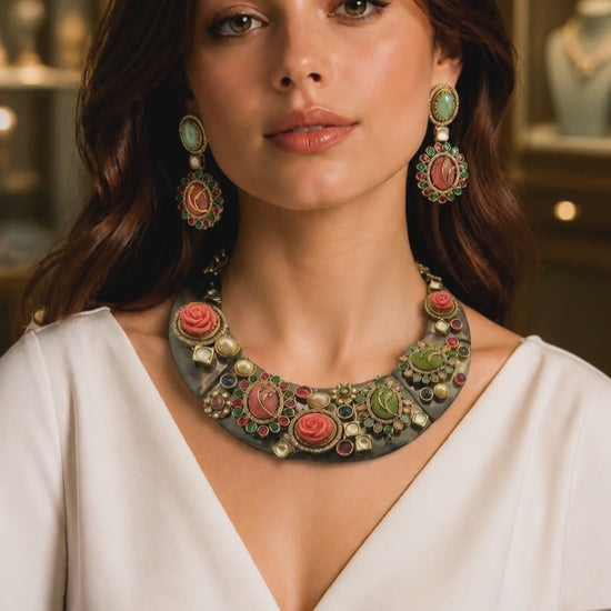 Handcrafted resin necklace with coloured stones, kundan detailing, floral accents, and matching earrings in ethnic statement jewellery style