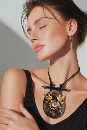 Resin pendant with bird motif and kundan and coloured stones