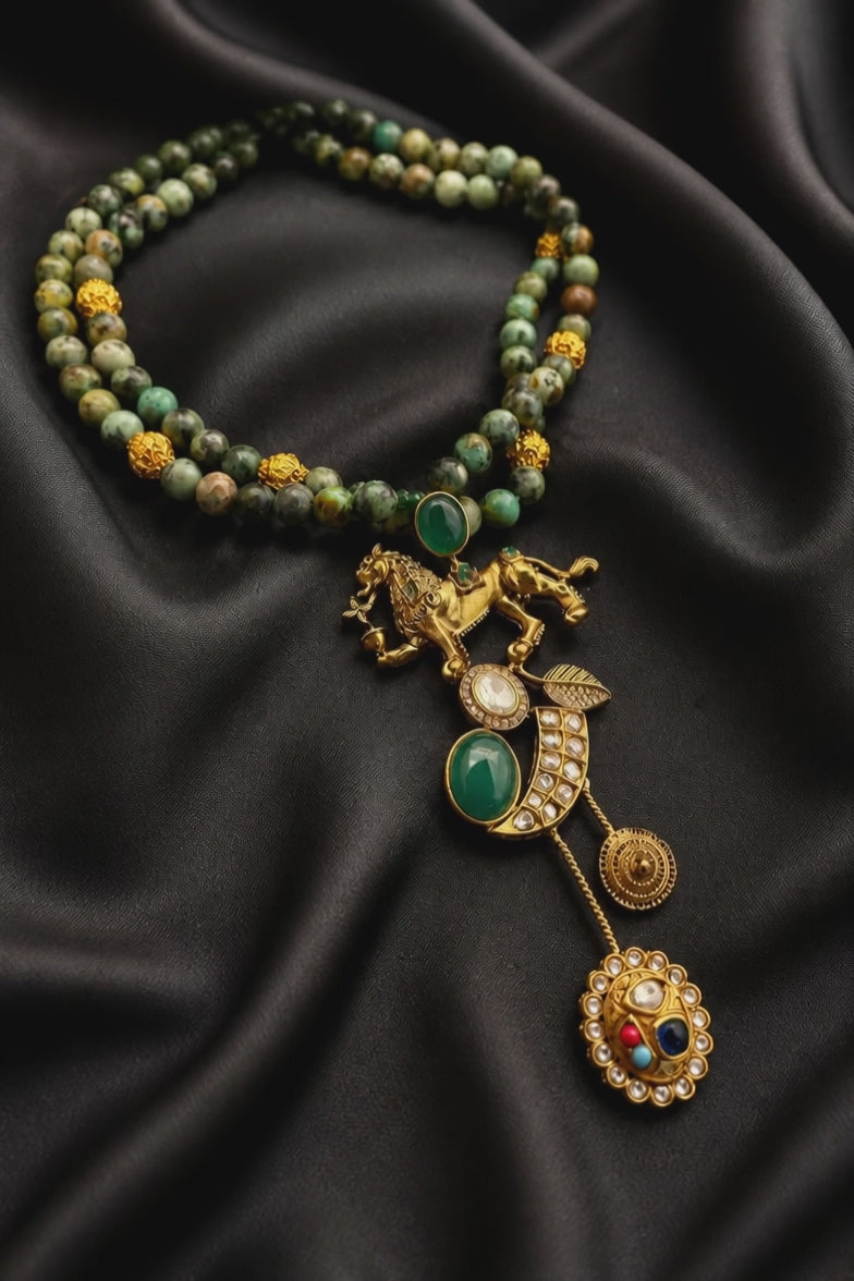 Designer lion motif necklace with kundan crystal detailing and greenish turquoise bead strands in traditional ethnic jewellery style