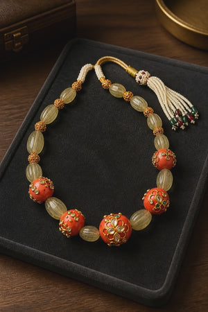 Luxury carved jade stone and coral necklace with intricate jadau work and handcrafted ethnic detailing