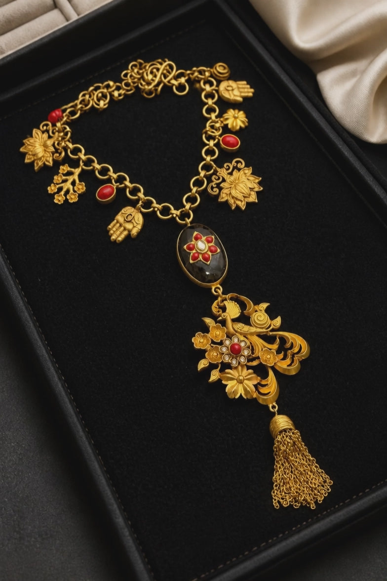 Designer charms style necklace with coral detailing and tassel pendant in traditional ethnic jewellery style