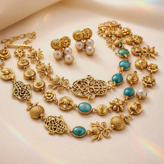 Antique gold layered necklace set with turquoise stones, floral motifs, heritage charms, and matching stud earrings displayed on a jewellery bust