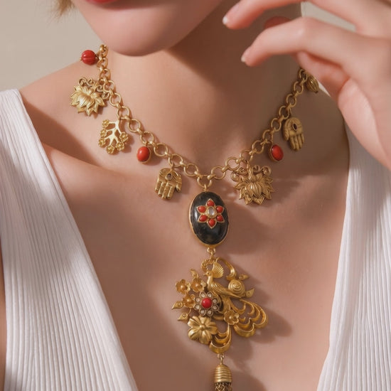 Designer charms style necklace with coral detailing and tassel pendant in traditional ethnic jewellery style