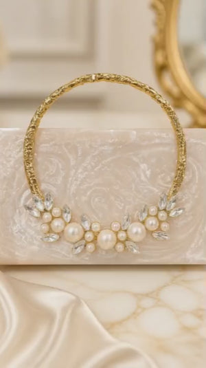 Luxury crystal bunch handle bag with pearl and crystal embellished gold handle and marble finish clutch body